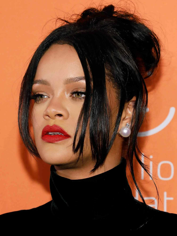 Rihanna, jet black hair, low cut, long layered bang